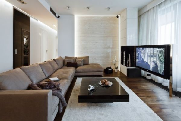 A modern apartment in Poland with a warm interior and an earthy color palette