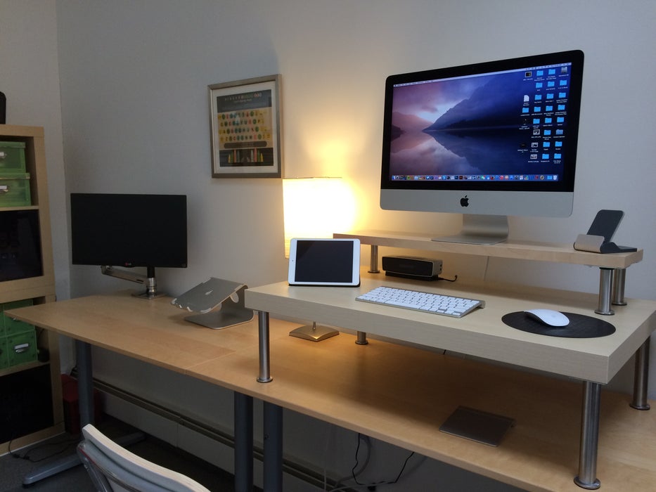 Standing desk with wall hanging