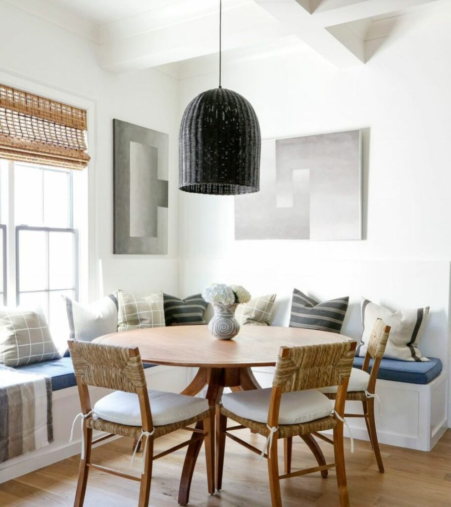 Black pendant lamp in rattan over the dining table